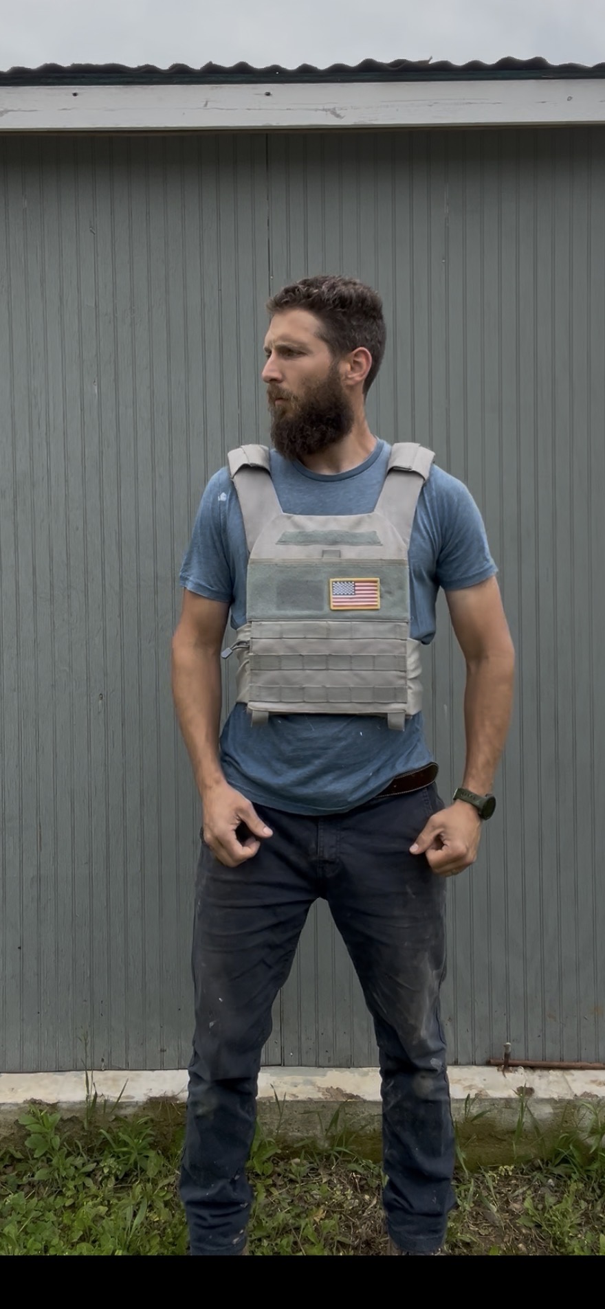Nate Ascher standing in front of a metal building