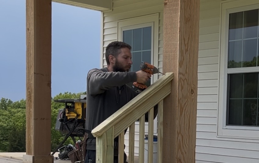 Nate Ascher building a deck with power tools
